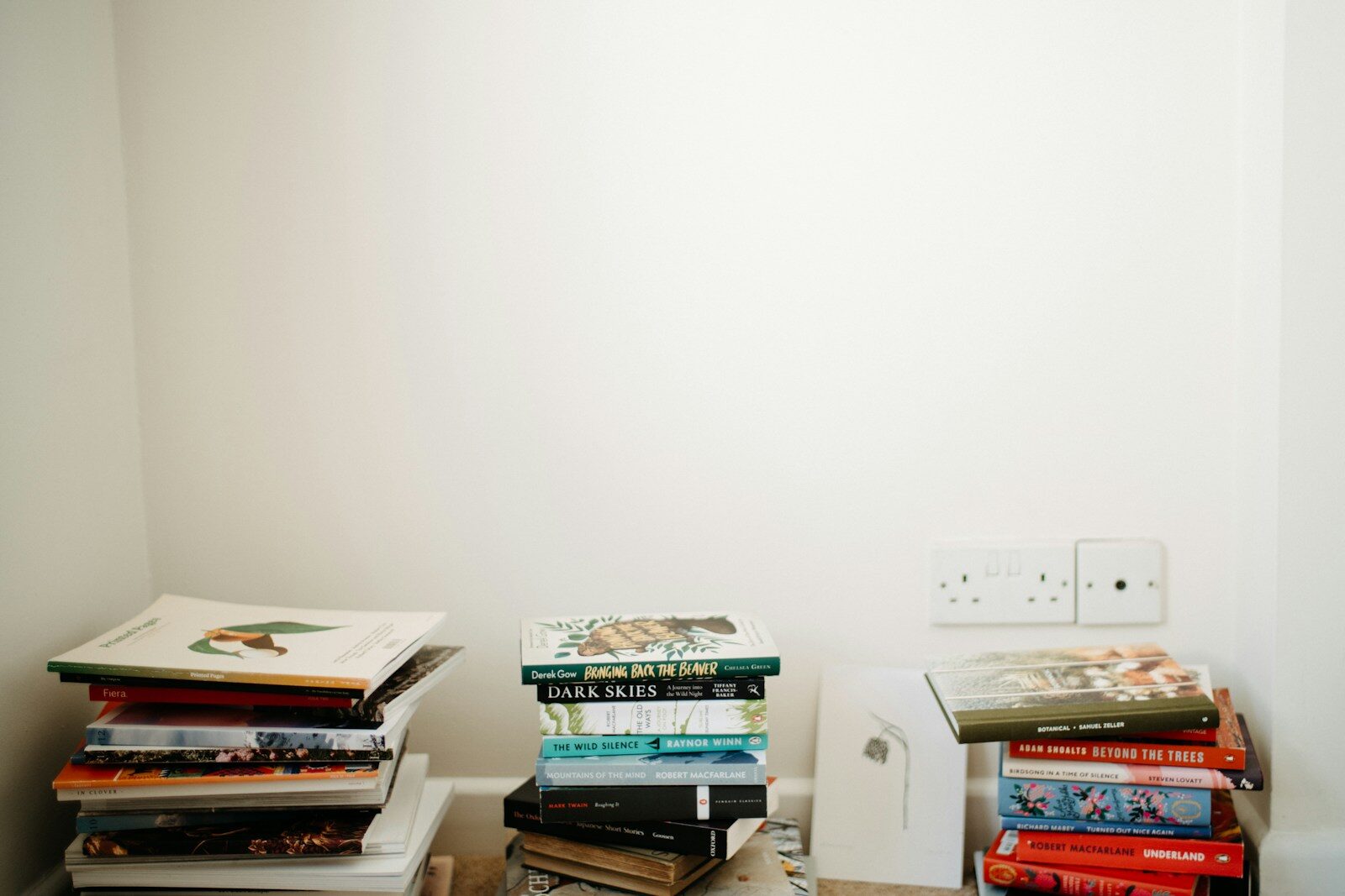 a stack of books sitting on top of a table